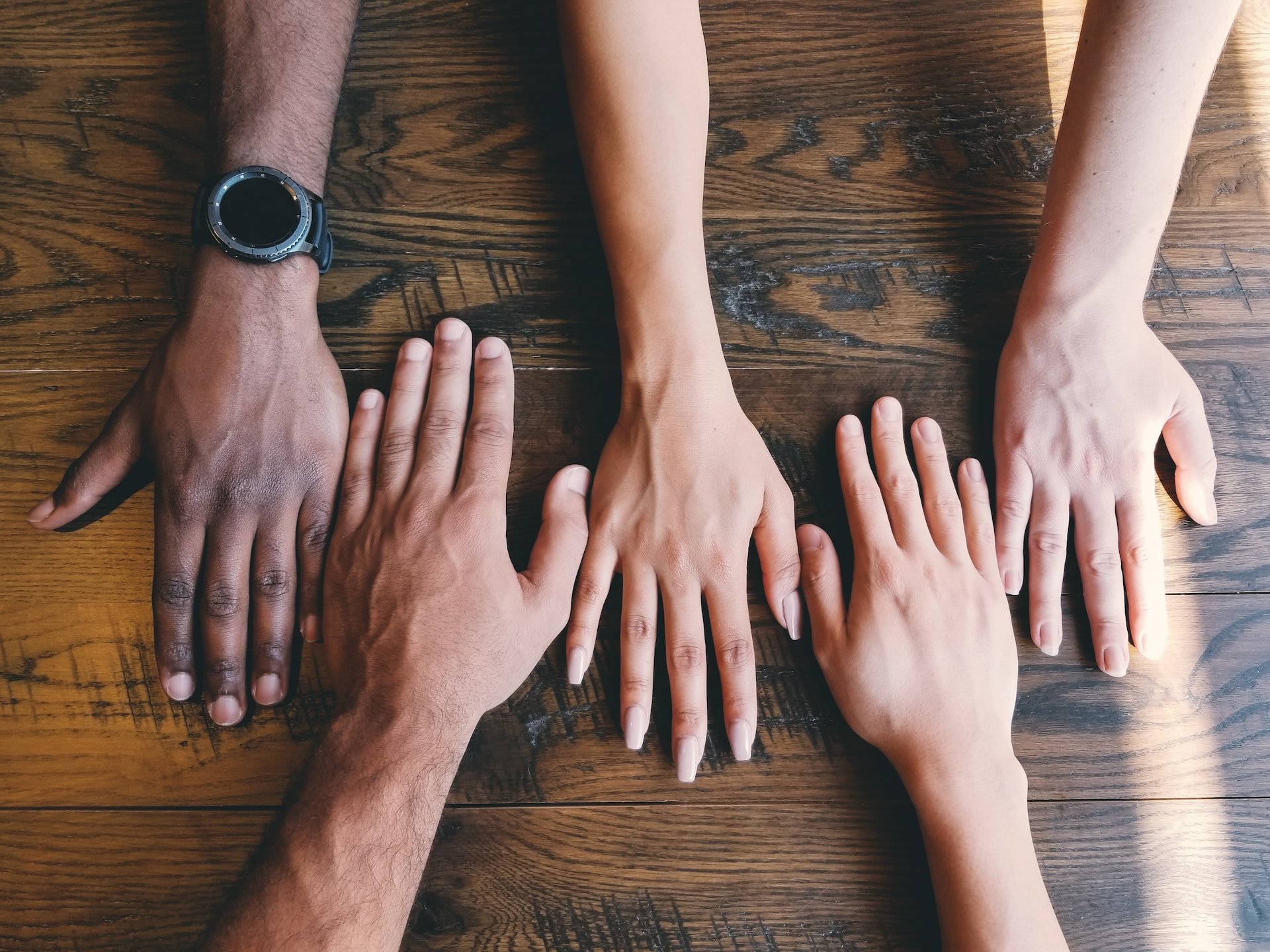 diverse hands of a team